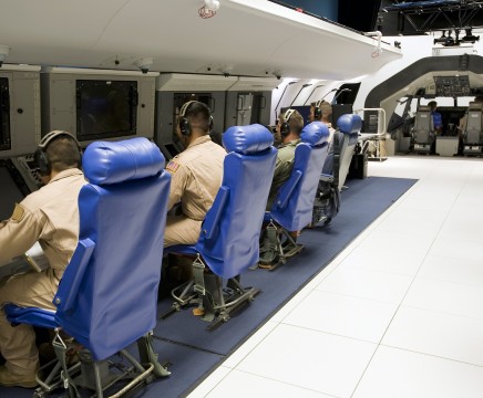 P-8A Integrated Test Team members occupy the aircraft stations inside the PaxSIL in preparation for a test flight. (Official Navy Photo)