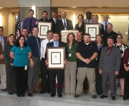 A few of the team members representing the Aircraft Launch and Recovery Equipment - program's Electromagnetic Aircraft Launch System, F-35C Joint Strike Fighter Jet Blast Deflector and Compact Swaging Machine teams who received 2011 Naval Air Warfare Center Aircraft Division Commander's and Innovation awards, which were distributed on Dec. 7. (U.S. Navy photo)