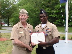 Hospital Corpsman 3rd Class Vanzorro Gross Jr. Receiving award from Rear Adm. Alton Stocks, Commander of Walter Reed National Military Medical Center 