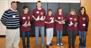First place team:  Northern Middle School, Calvert County James P. Dell, President of the Southern Maryland Chapter of the National Society of Professional Engineers with the first place team members Jim Kong, Will Longsworth, Preston Southan, Nathan Hayes, head coach Carole Butler, and coach Lynda Ciardiello. 